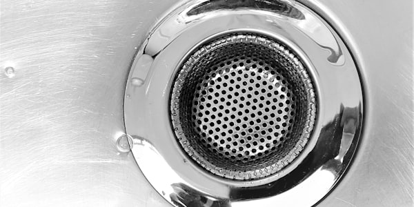 Close-up of a stainless steel sink drain